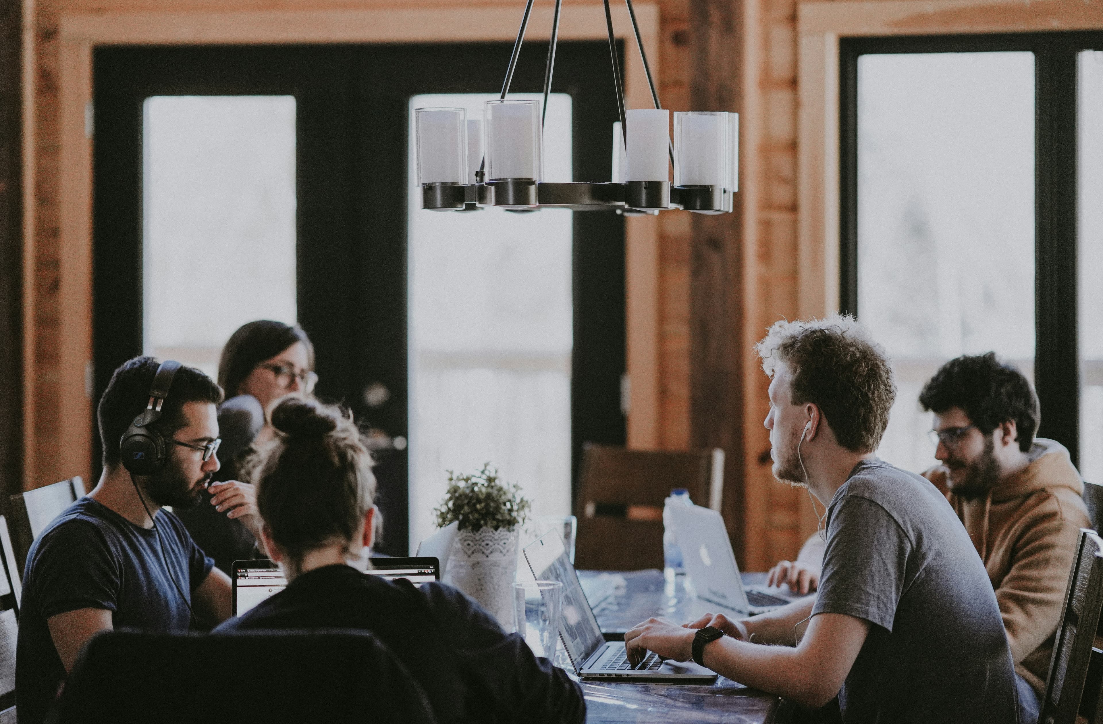 Business professionals in a long-term strategy meeting — the partner-first model in practice